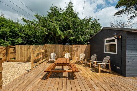 Modern cabins with sunny lounge & deck sleeps 18