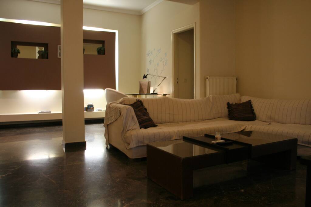 This couch is one big cozy pillow inviting you to enter its comfort zone. You won't be able to resist especially after a long day of walking around the neighborhood. Did I mention that the neighborhood includes the Parthenon? You won't be able to escape its view.