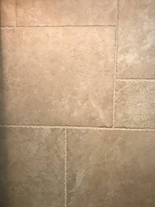 Hand chosen ceramic tiles for the bathroom walls and floors in the Trullo.