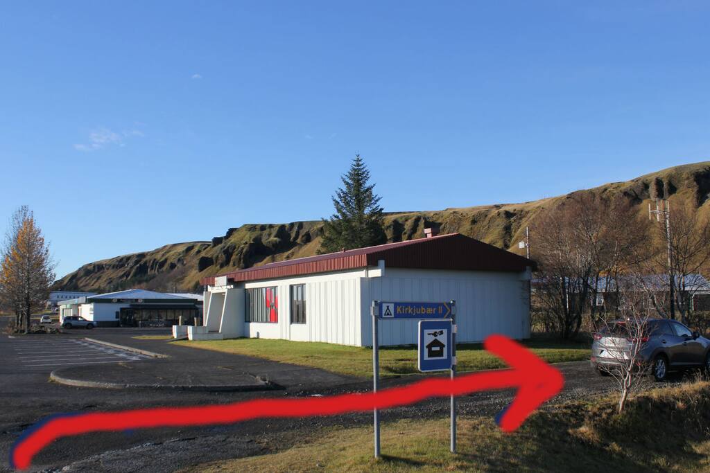 Turn right when you see the licquer store and drive 300 m .