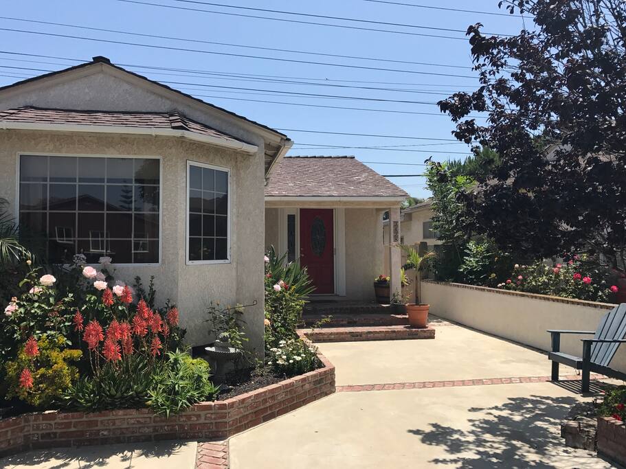 Flower beds leading up to the front door.