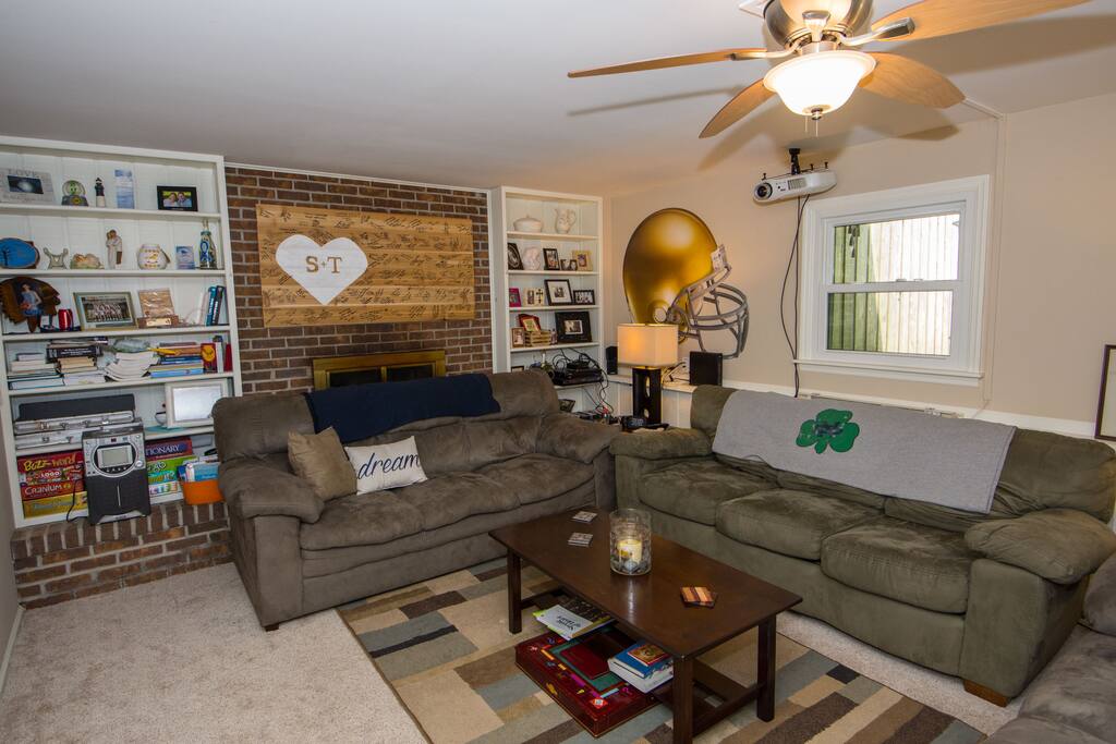 Get cozy in the ND themed lower level. Three full-size couches will be sure to fit all the fans while you watch the big screen or play games.