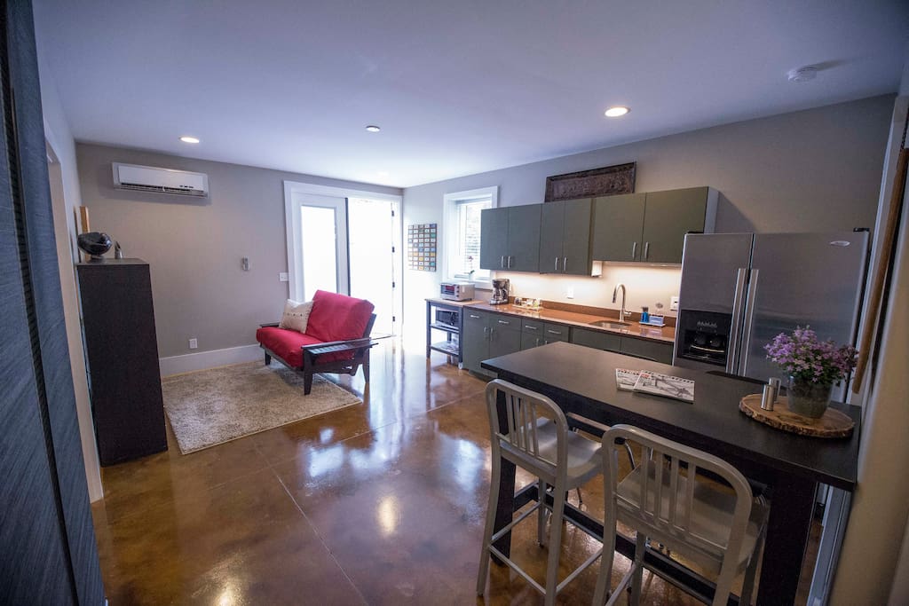 Main living area, kitchenette and dining table or use for your work station