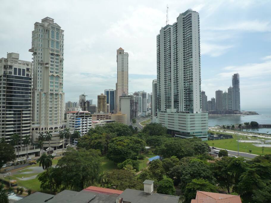 The view from your room, over the trees of Parque Urraca, the tip of Punta Paitilla, and Balboa Avenue going into MultiCentro area.