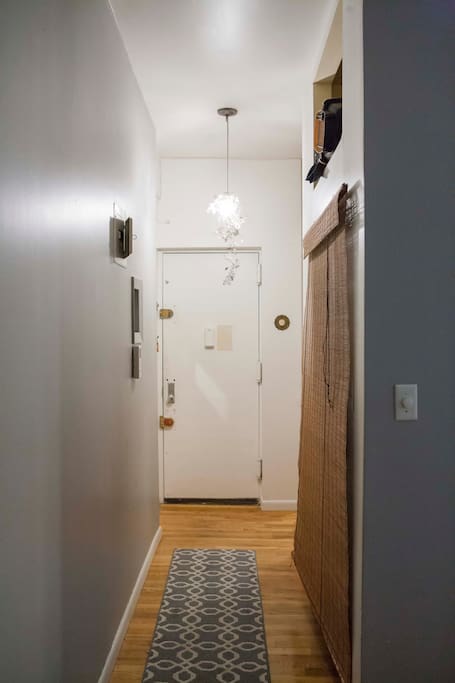 Long hallway separates the bedroom/office