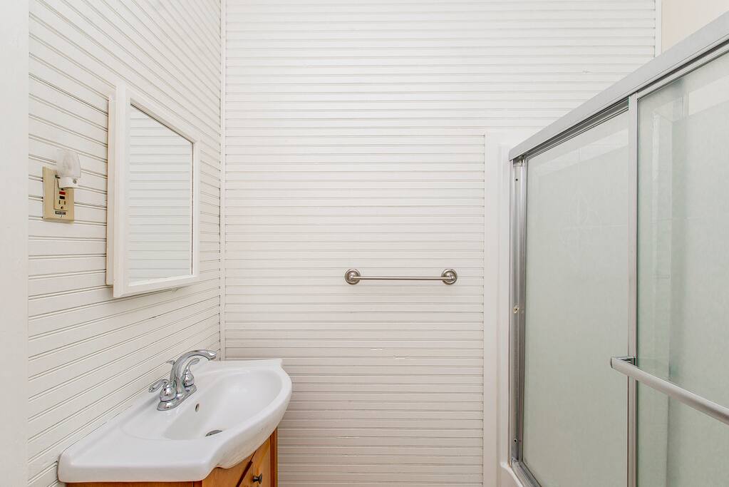 Bath with full tub and shower.