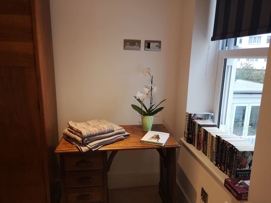Desk space to work or write your postcodes. Fold up chair provided