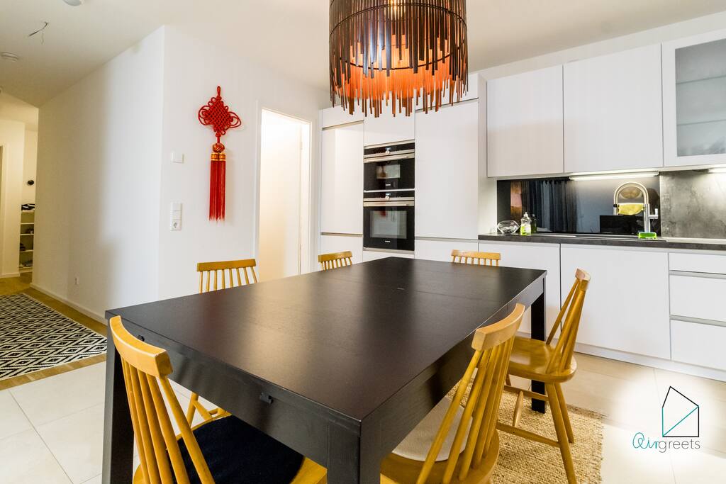 You can enjoy your meals or work with the laptop at this wooden dining table.