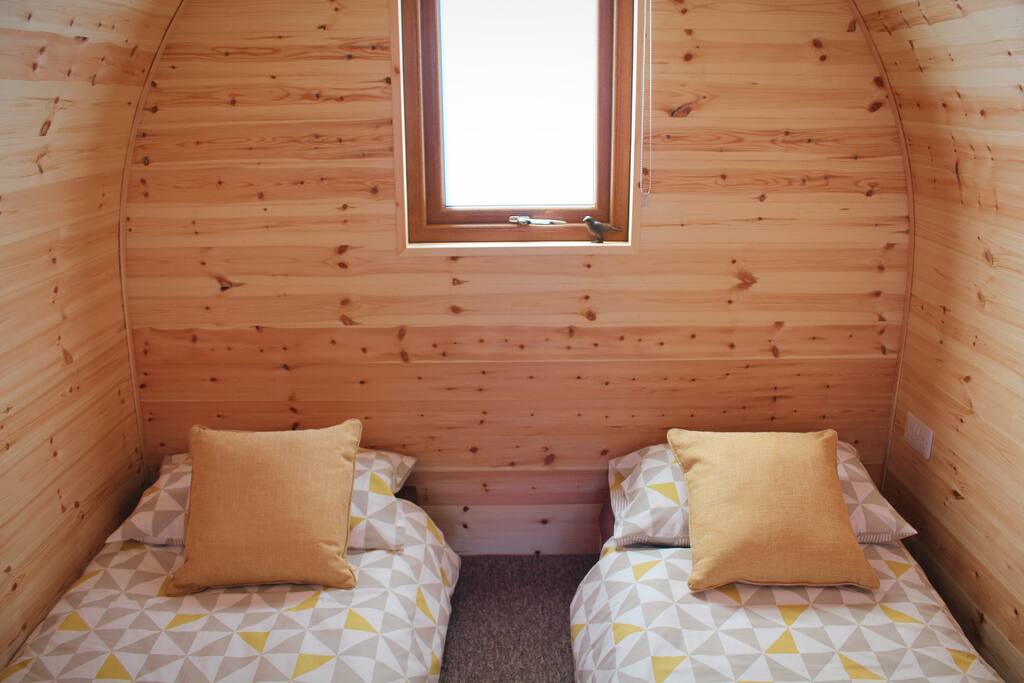 Pod set up as a twin, with additional bedding