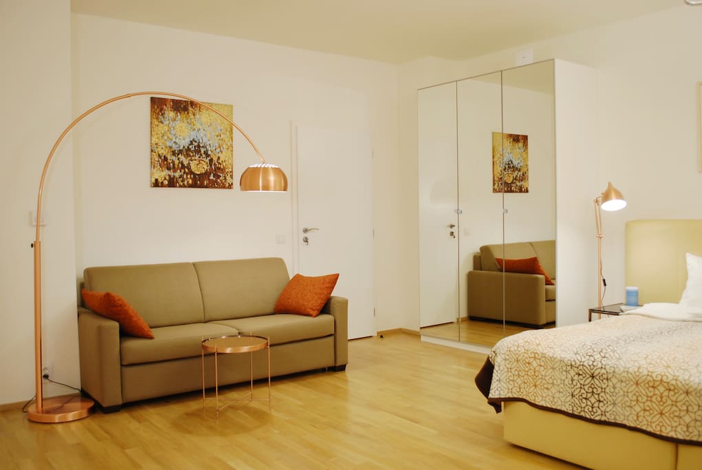 Convetible sofa with a sleeping mattress provides a cofortable extra sleeping place