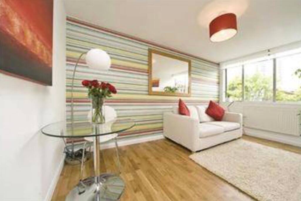 Living room with sofa bed, large LCD TV and WiFi