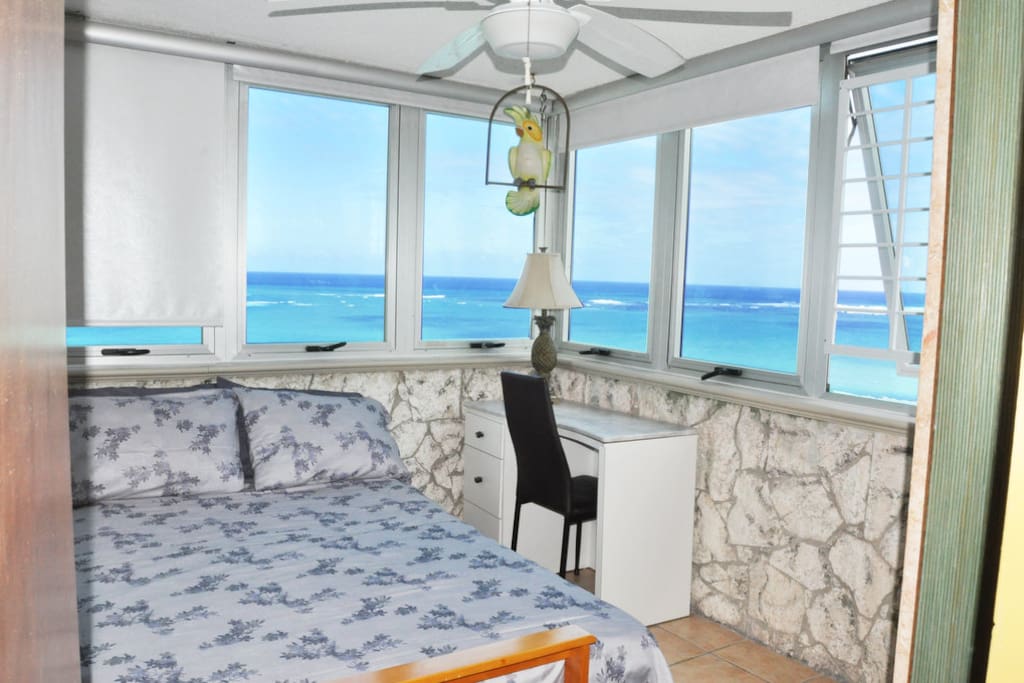Room with amazing views to the sea and a sofa futon.