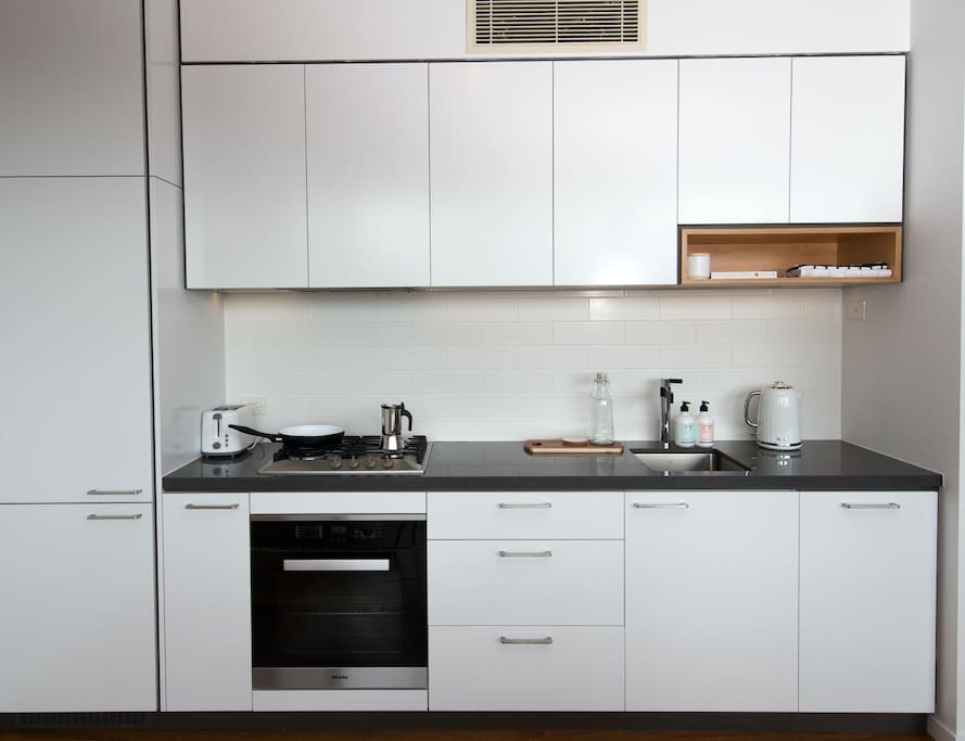 Kitchen facilities with complementary coffee for residents.