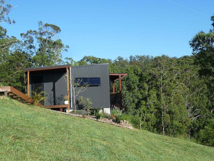 The cabin is nestled amongst the trees with plenty of shaded areas.
