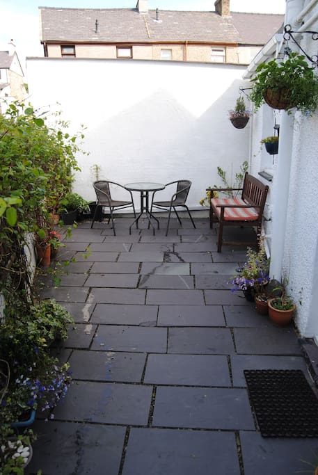 Front slate patio, great sun trap with bench & bistro set