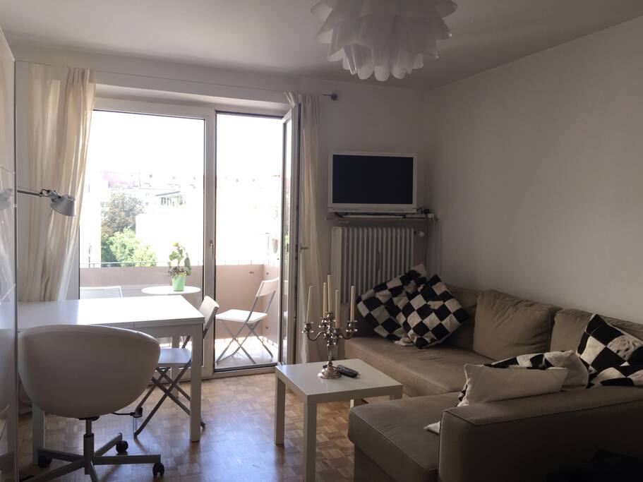Main room (1) | Includes a spacious couch | Dining table | Queen-size bed | Balcony attached
