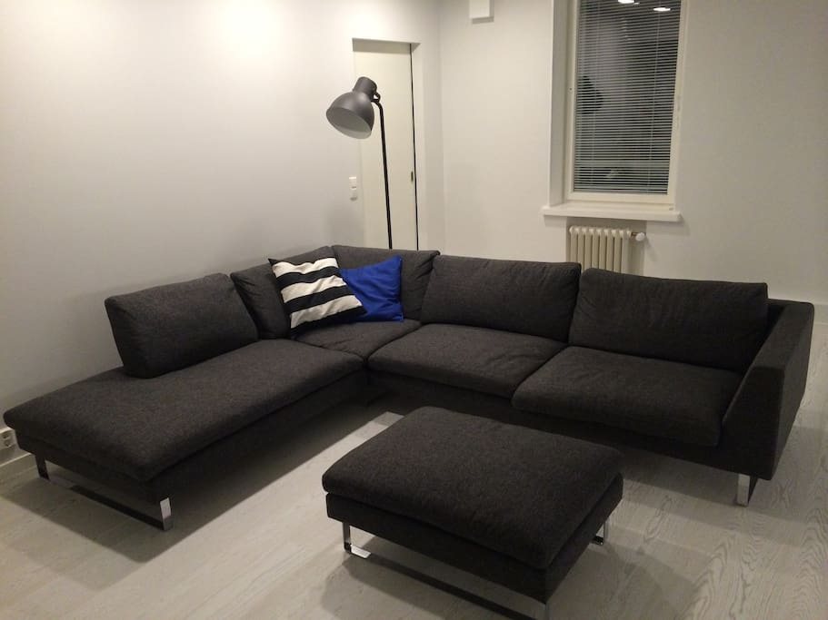 Comfortable sofa with footstool