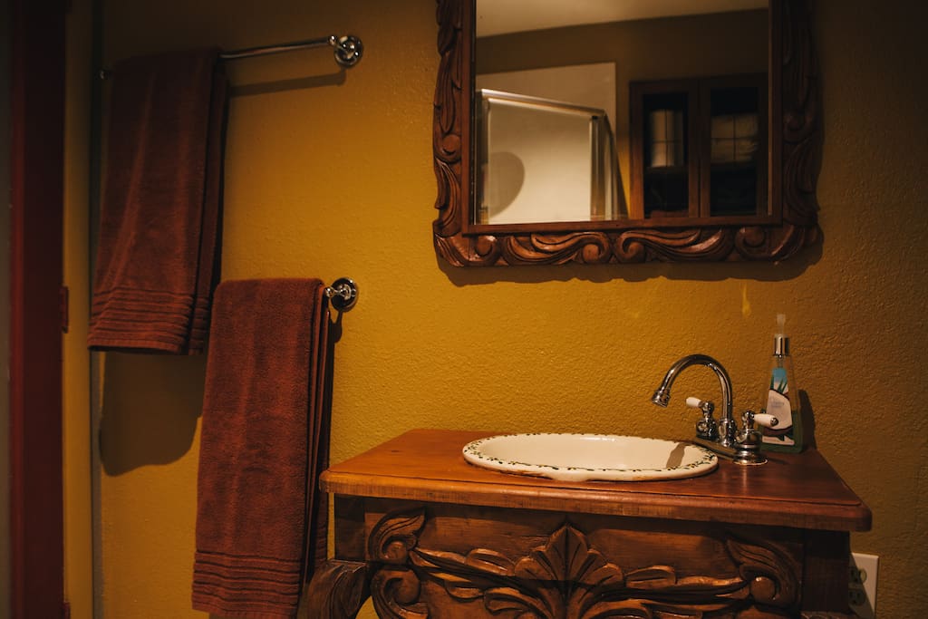 The bathroom sink and mirror are imported from Sonora Mexico