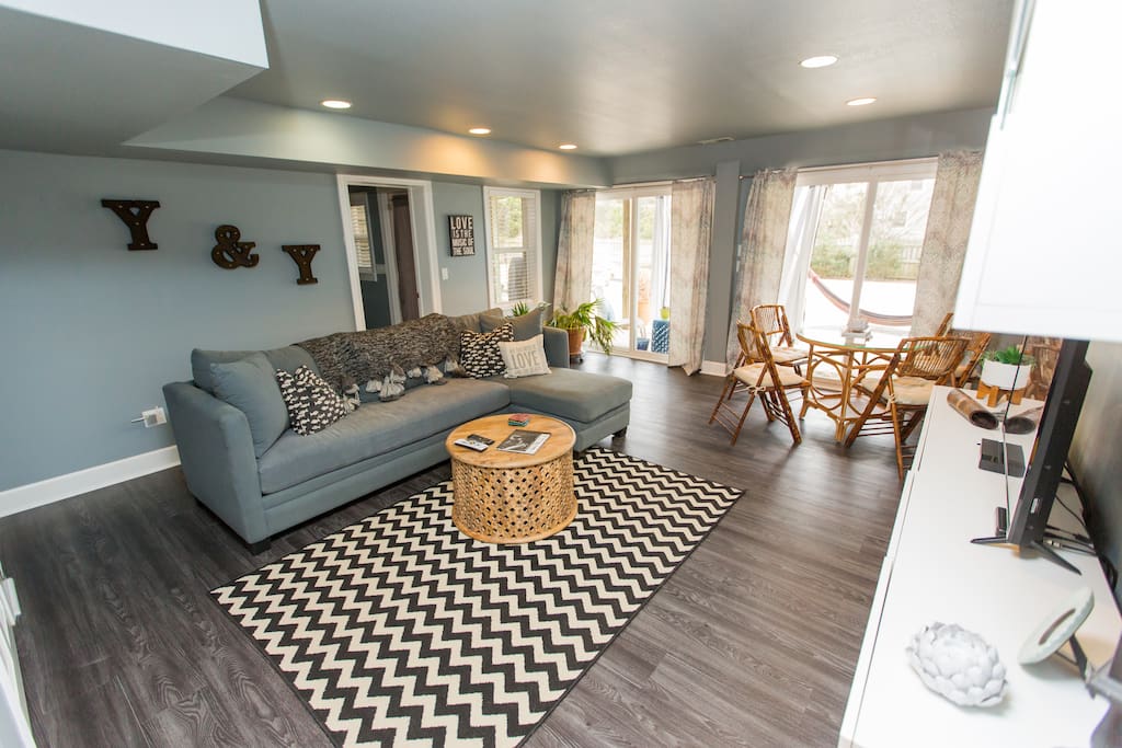 Large living area, second bathroom behind the couch, pool is just outside the slider doors.