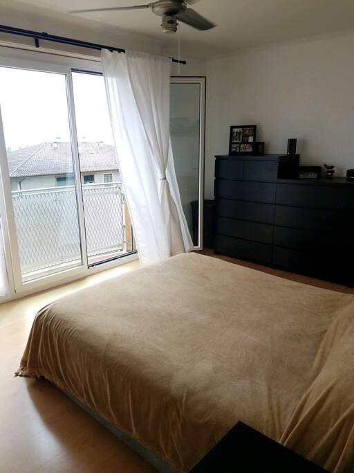 Bedroom with a queen size bed and lake view.