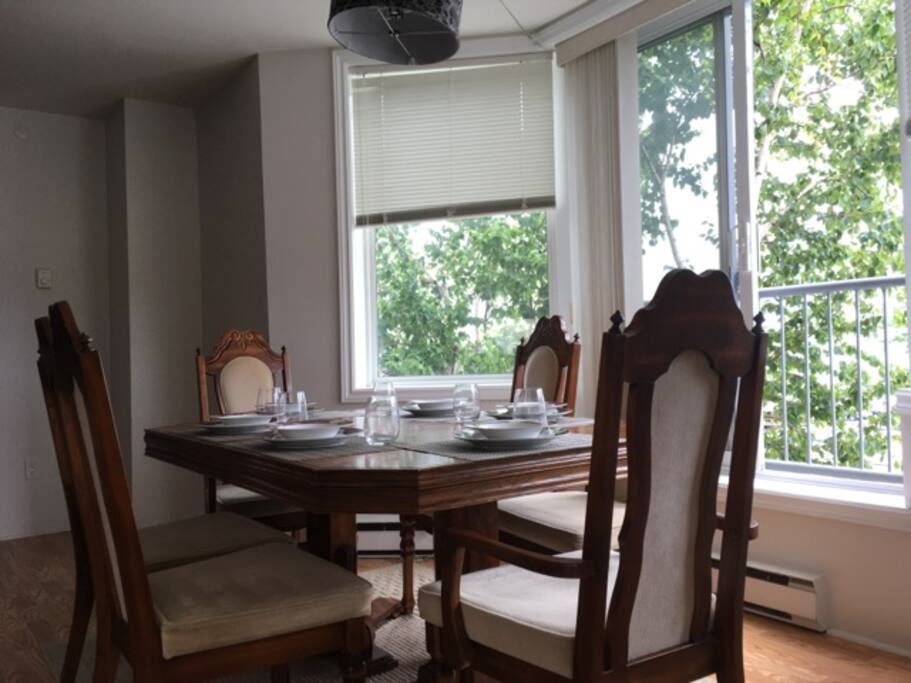 Dining room seating for six in huge open-concept room, harbor views