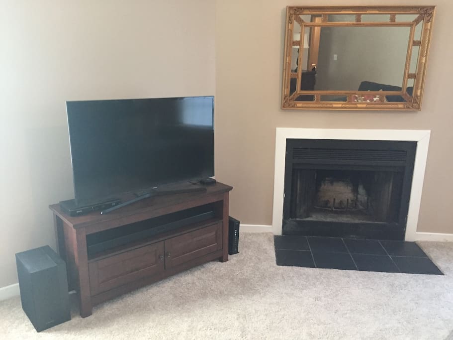 TV with a sound bar, as well as Apple TV. Enjoy netflix, airplay, or connect to the sound bar through bluetooth to play your own music.