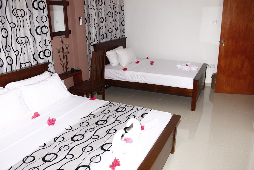 Family room, one king size bed and one double bed.