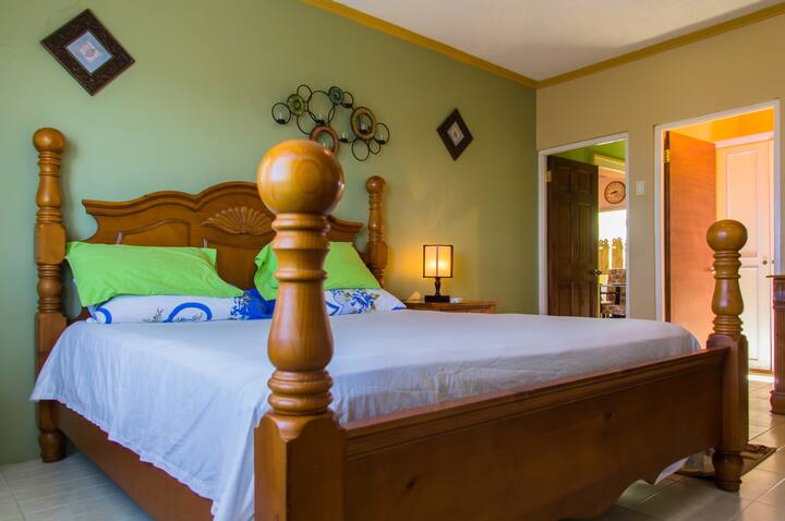 Sleep well in this cozy king-sized bed.