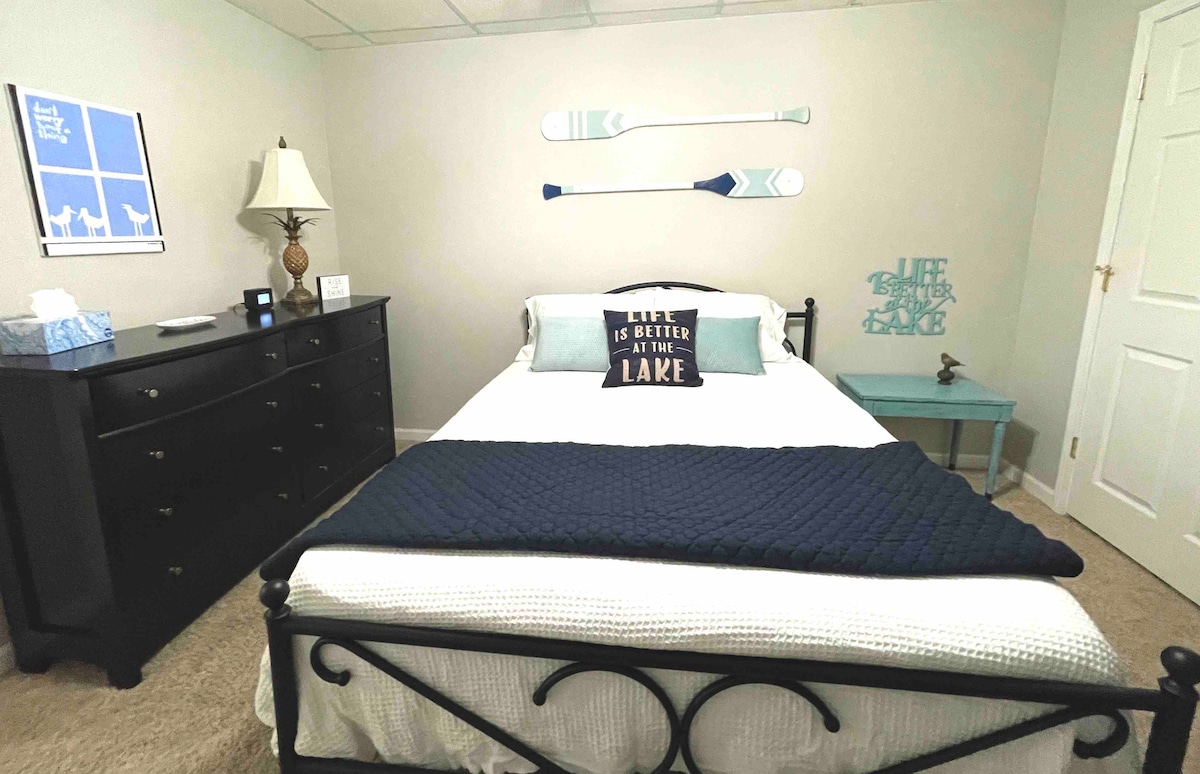 Queen size bed downstairs.