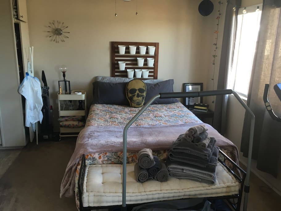 Bedroom area. Ceiling fan above bed.
