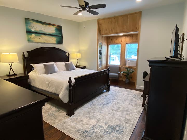 Master bedroom. King-sized bed, reading nook, and workspace.  TV with ROKU.