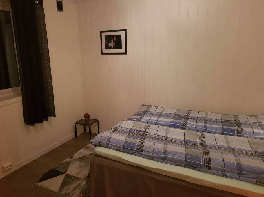 Spacious bedroom with a comfortable bed