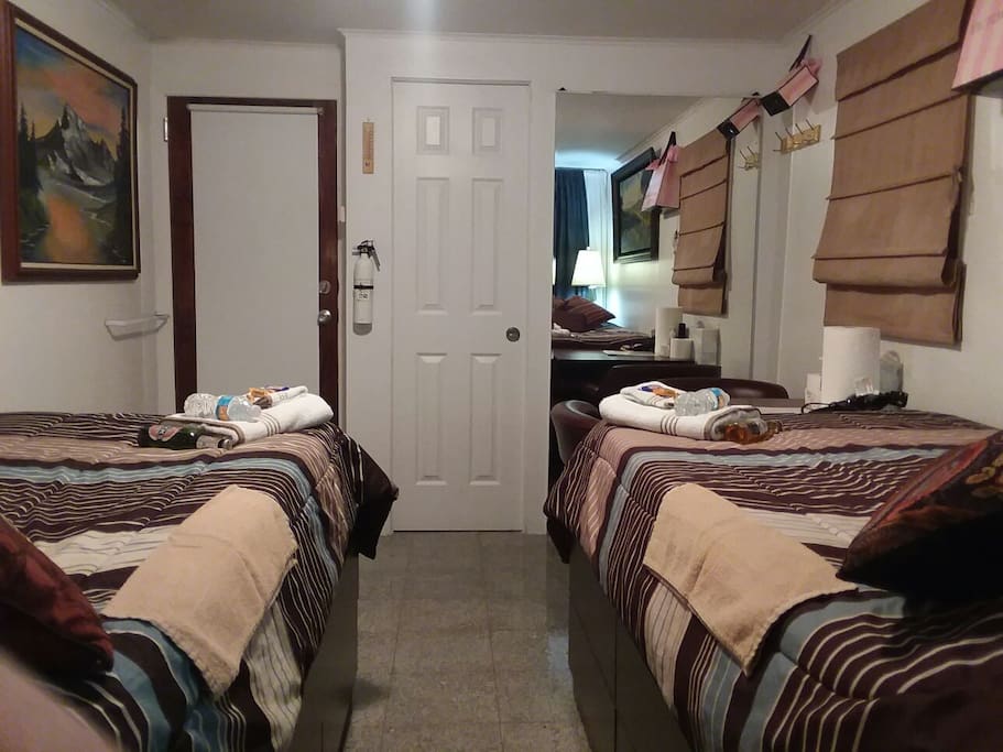 Same bedroom, double beds convertible to one bed.