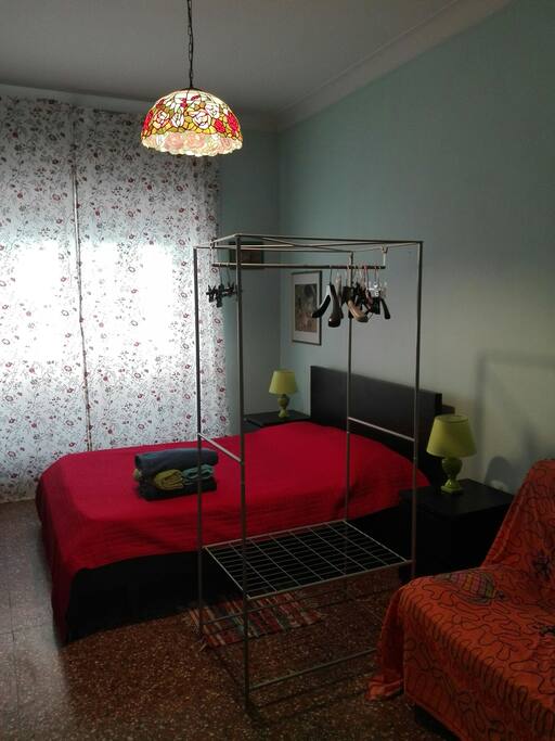 An idea. ..you can put open guardrobe to separate double bed from sofabed