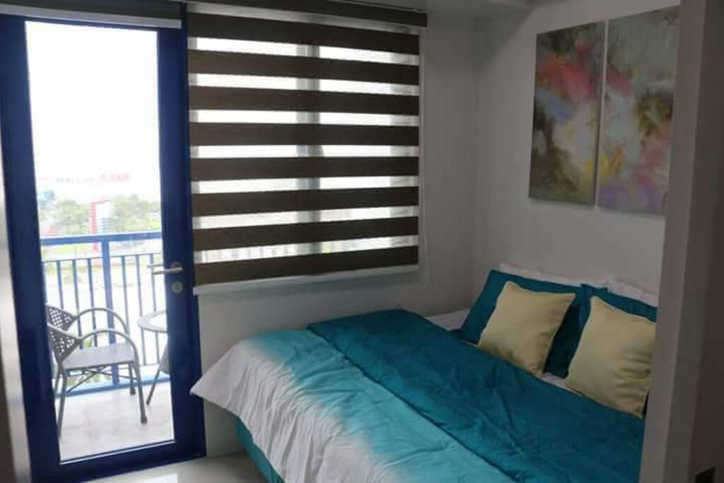 The bedroom overlooking the beautiful Manila Bay and SM Mall of Asia