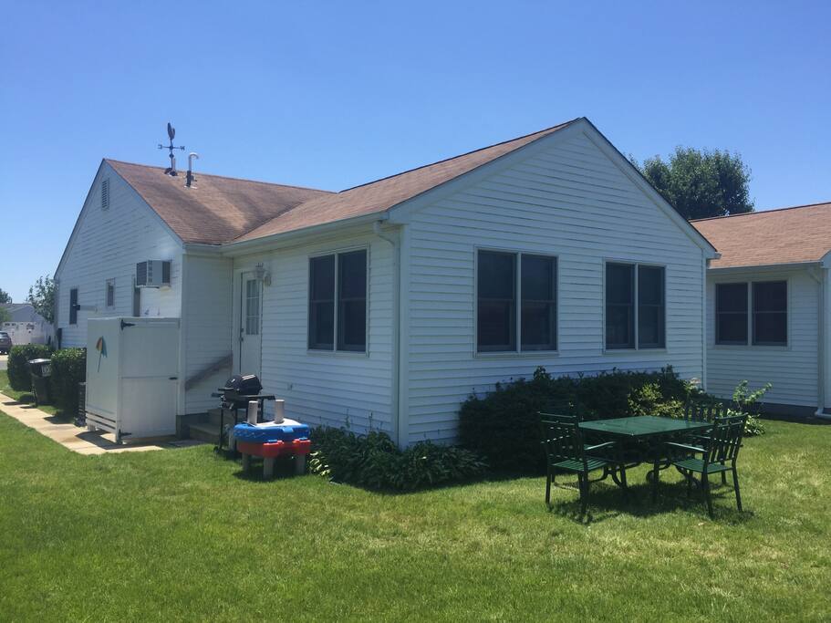 Outdoor dining in private back yard with included gas grill.