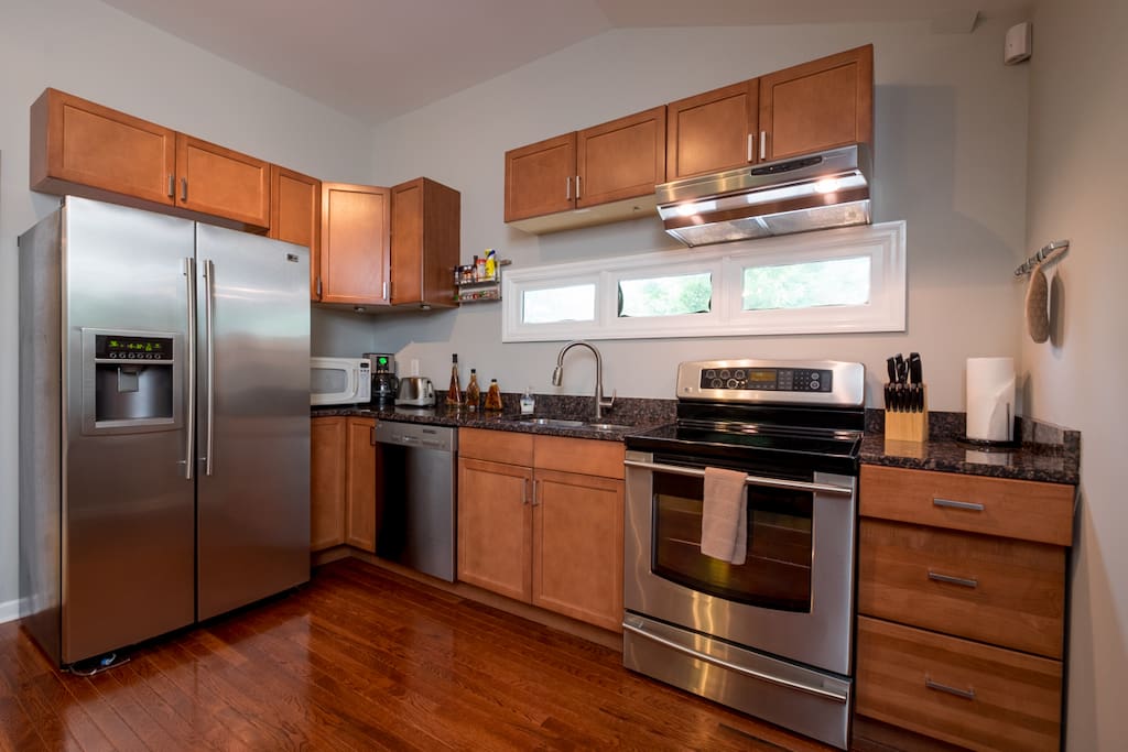 Full kitchen includes fridge, freezer, dishwasher, oven, stove, microwave, cooking utensils, coffee maker, etc.!