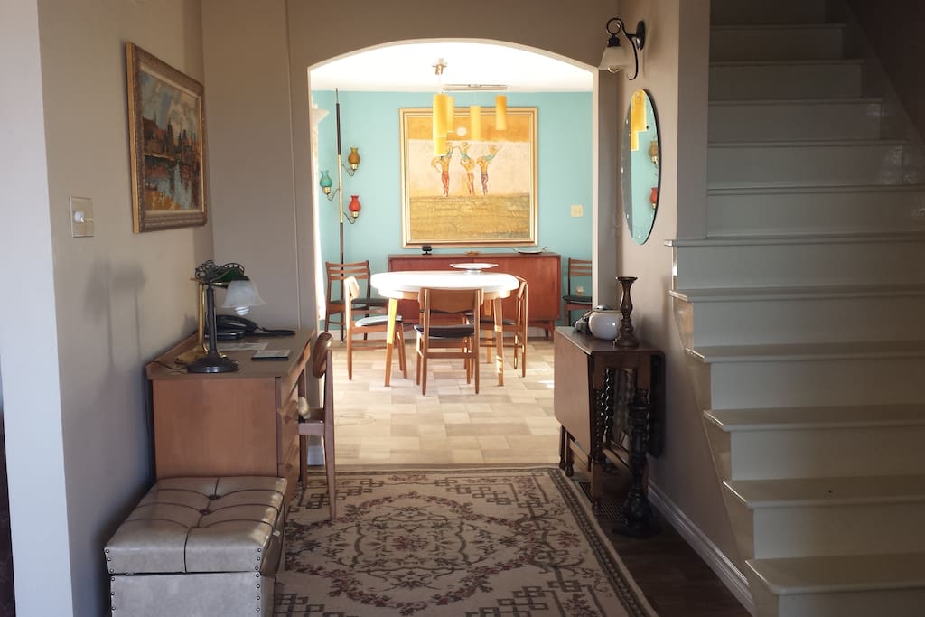 This is the view as you enter - the Dining is straight ahead, the Living Room, Powder Room and Back door to Deck is on the left and the Master Bedroom, Ensuite and WIC are to the right of the stairs.