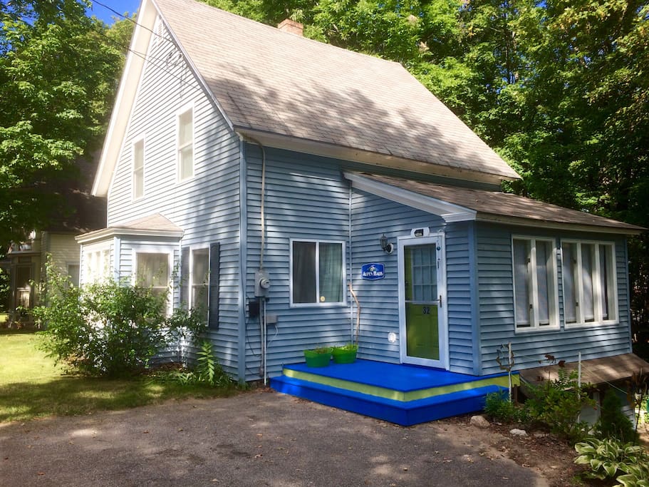 This is what the house looks like - unassuming light blue color, with only a hint of personality in the yellow door and bright blue steps. Once you step through the door, BAM! - you enter another realm!!!!!!
