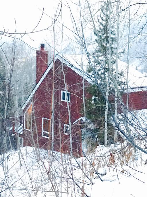 View of the house down the hill as you approach from the road.