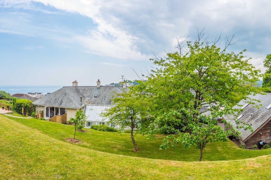 The 1 acre garden of #TheGardenStudiosBudleigh, cherry trees and far reaching sea views of the bay in Budleigh
