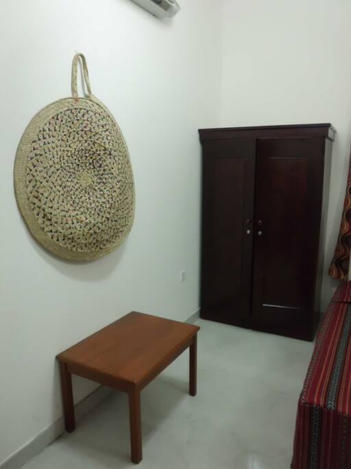 wardrobe and luggage table in bedroom