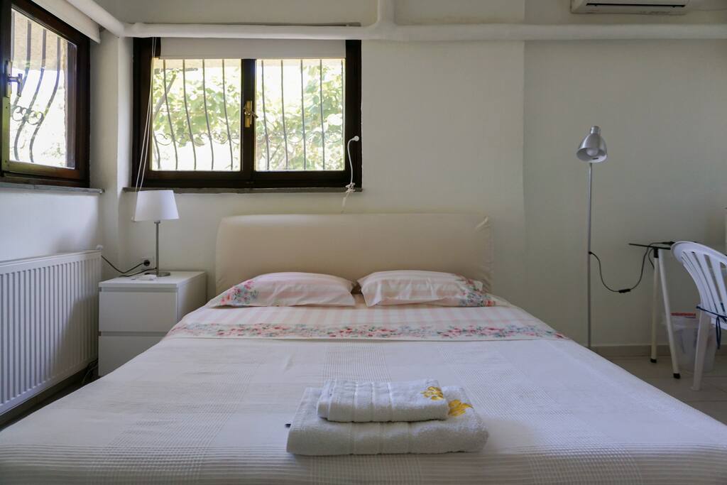 The double bed in bedroom #1