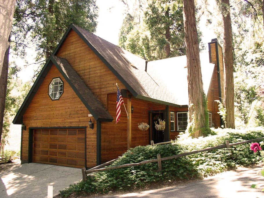 Home nestled among trees and close to walk to the lake, beach club or Village