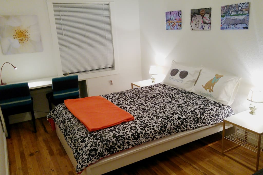 The master bedroom boasts a queen size bed.