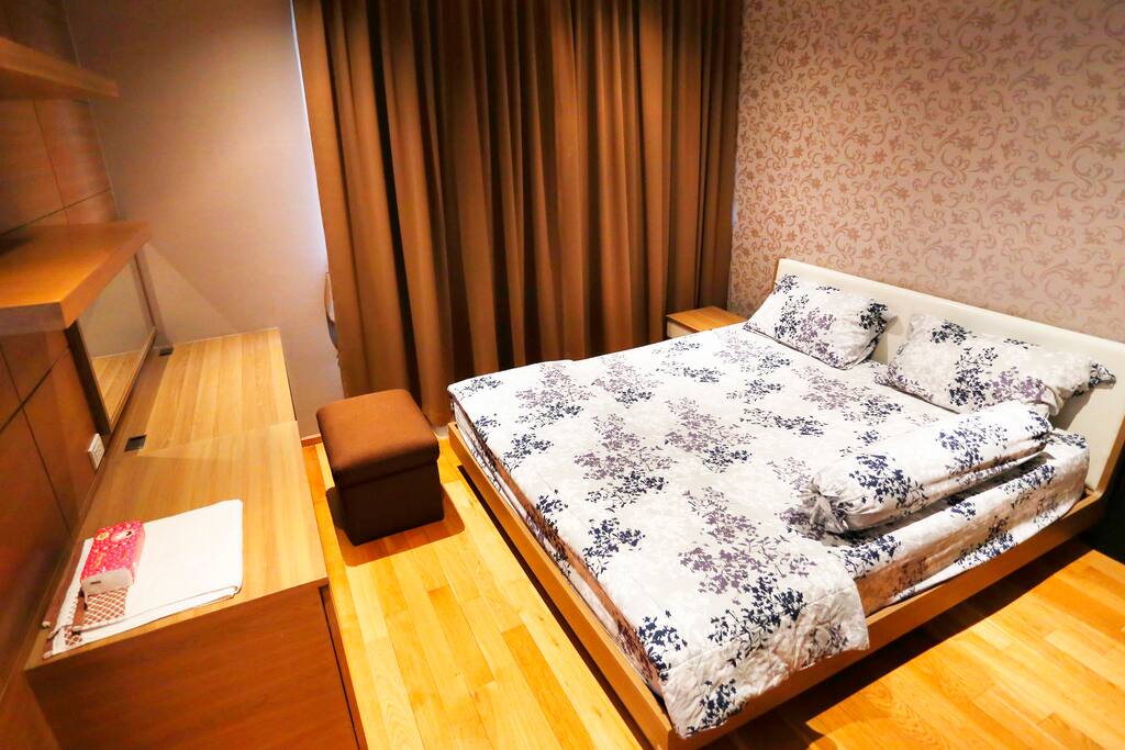 Spacious master bedroom with king-size mattress