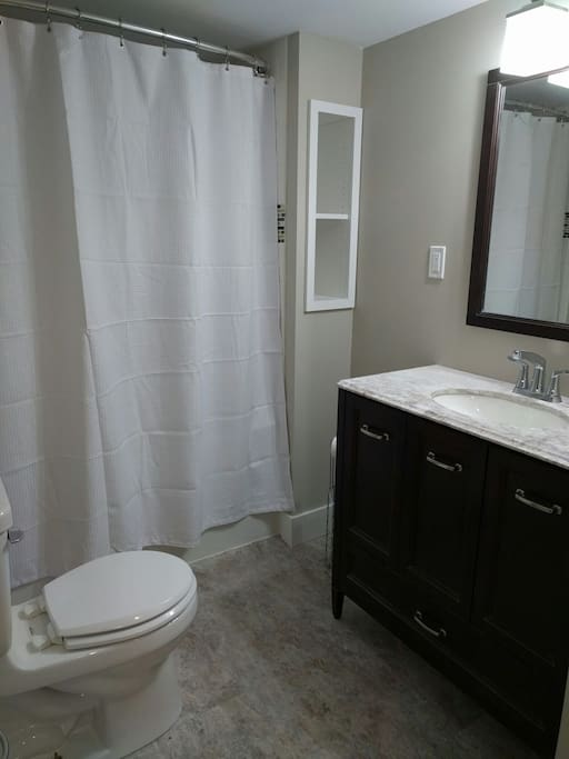 Full 3 piece bathroom with washer and dryer.