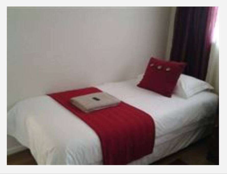 Second bedroom with 2 single beds.