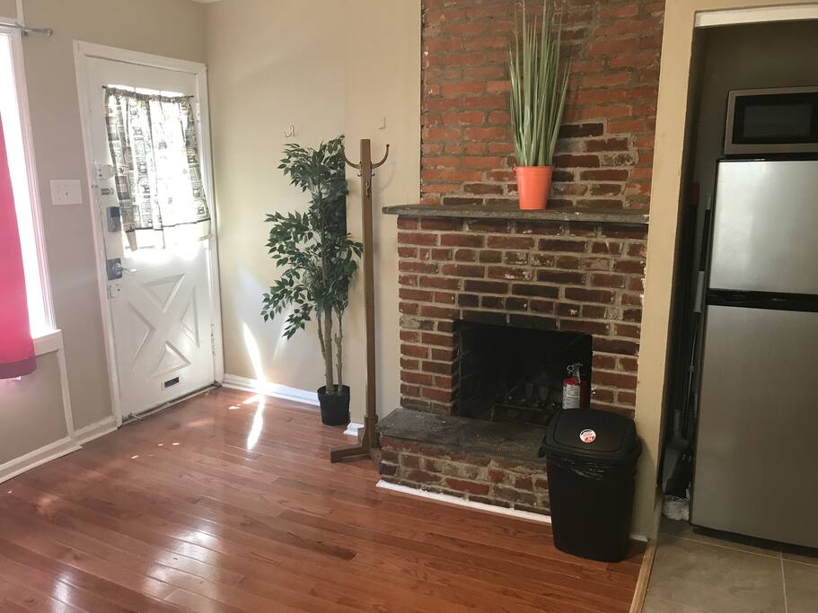 View Across Living room. Original fireplace