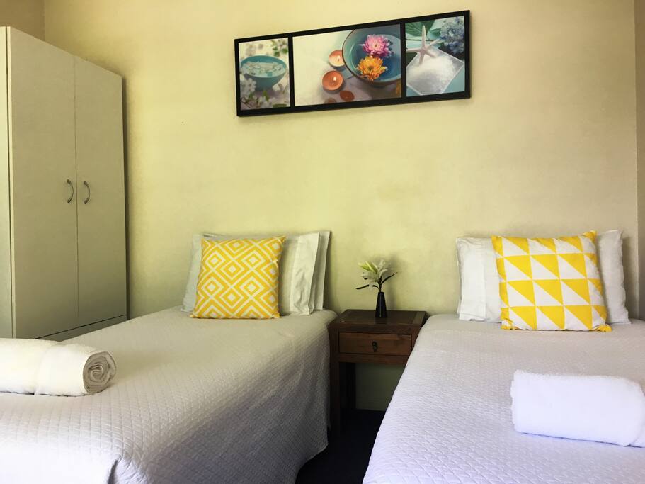 Two single beds and wardrobe